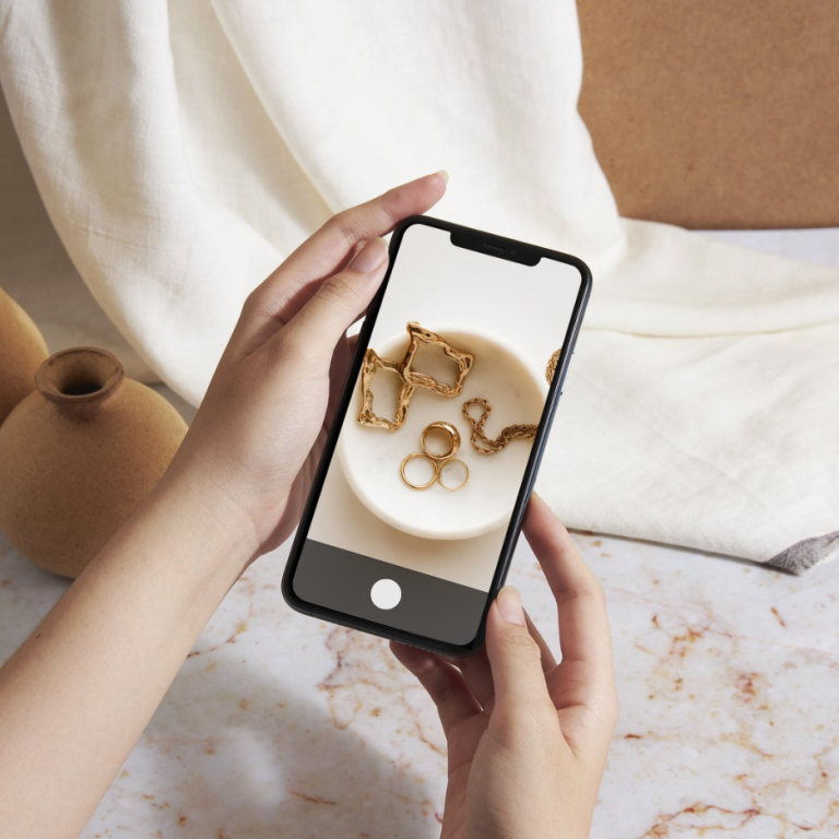 woman taking photo of jewellery